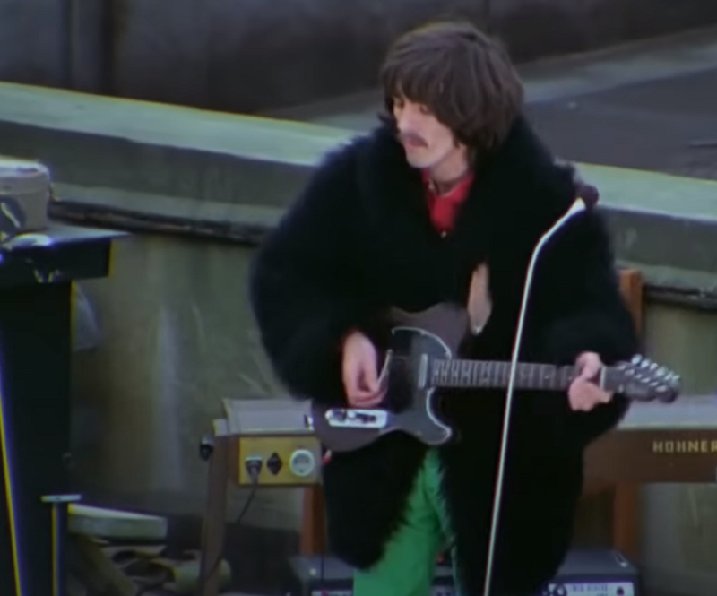 George Harrison playing a 1968 Fender Rosewood Telecaster electric guitar at the Beatles Rooftop Concert