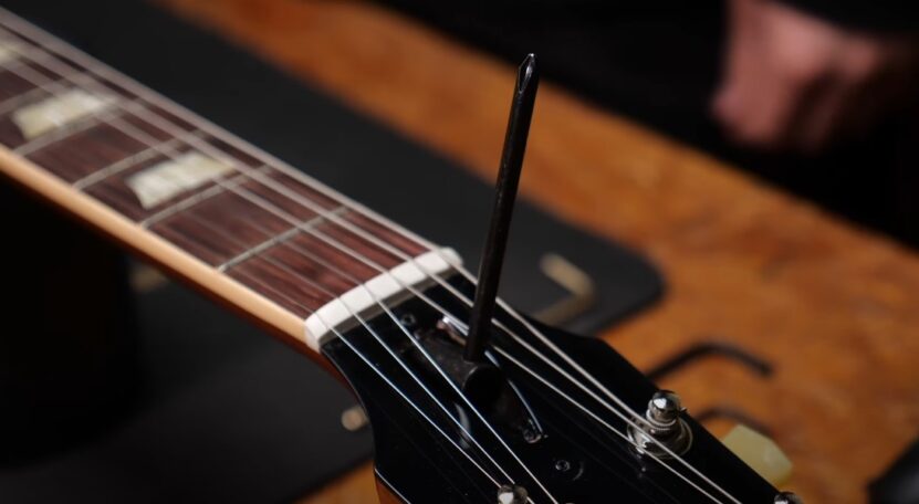 Adjusting acoustic guitar truss rod